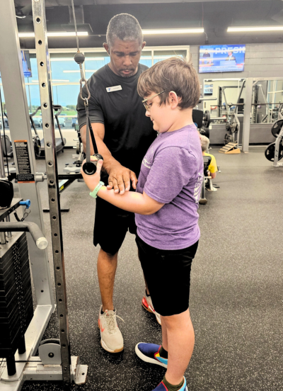 Shawn Cofield Training Young Boy in Proper Form